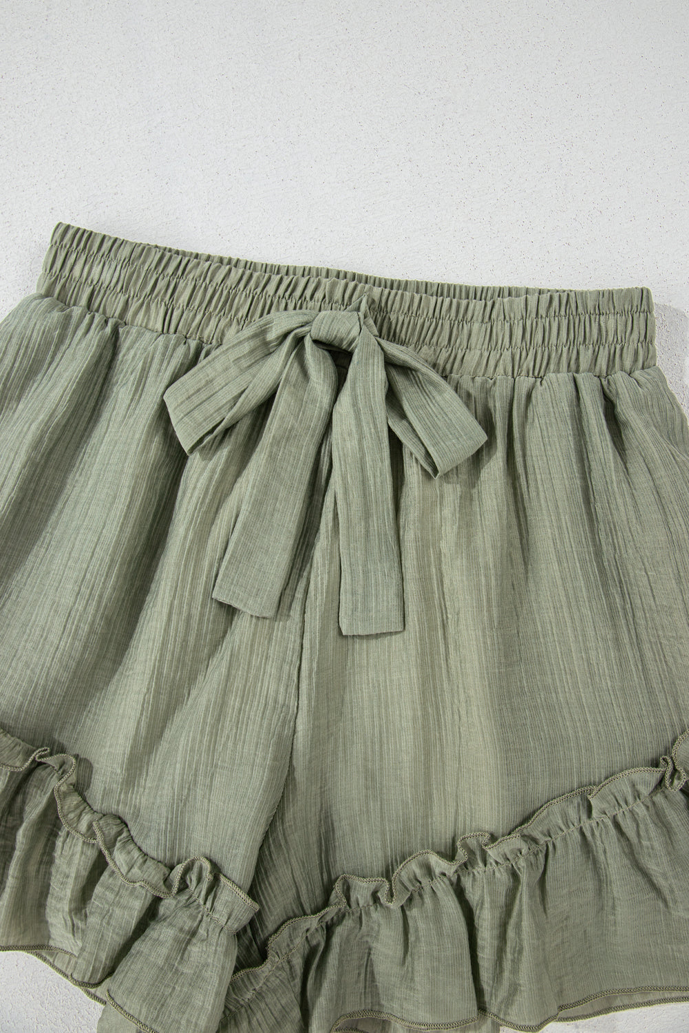 Earthy Green Textured Tie Waist Ruffle Hem Shorts