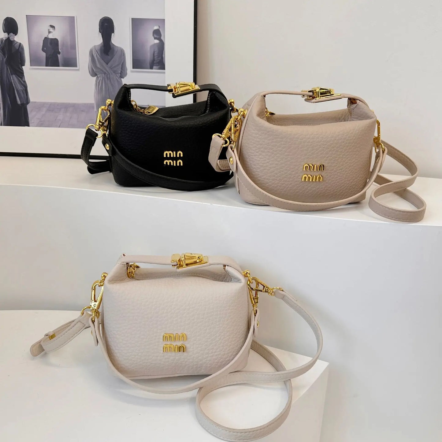 2025 Luxury high-end designer lunch box style shoulder/cross-body messenger bag with a lychee pattern .