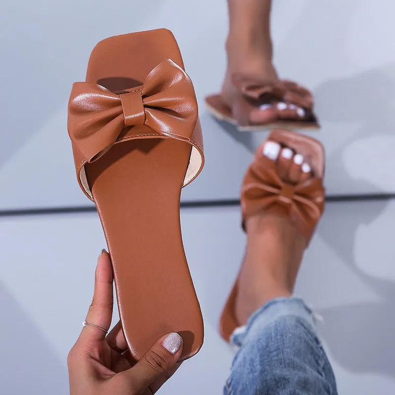 Spring/summer new flat leather bow non-slip casual all-match fashion women sandals.