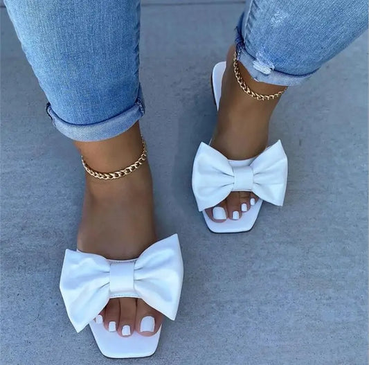 Spring/summer new flat leather bow non-slip casual all-match fashion women sandals.
