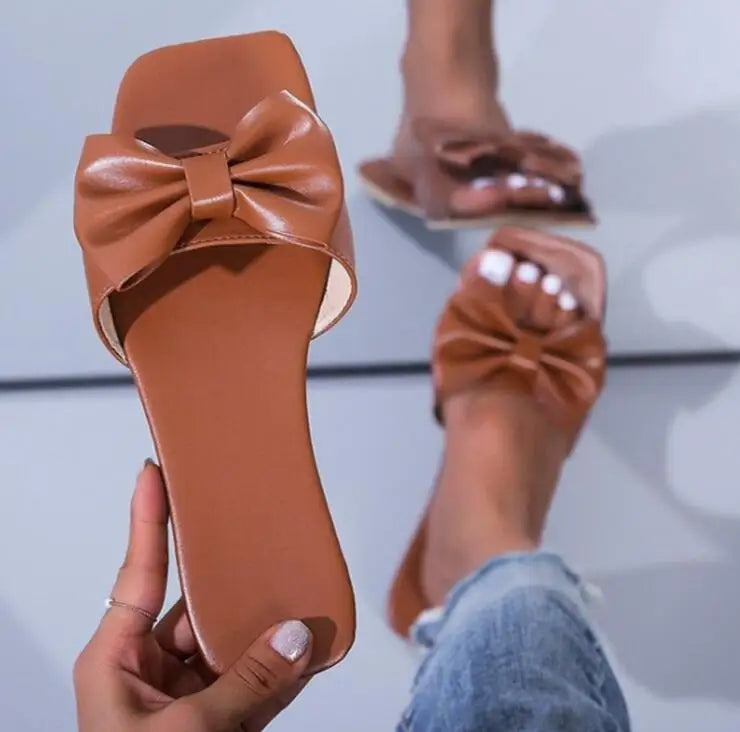 Spring/summer new flat leather bow non-slip casual all-match fashion women sandals.