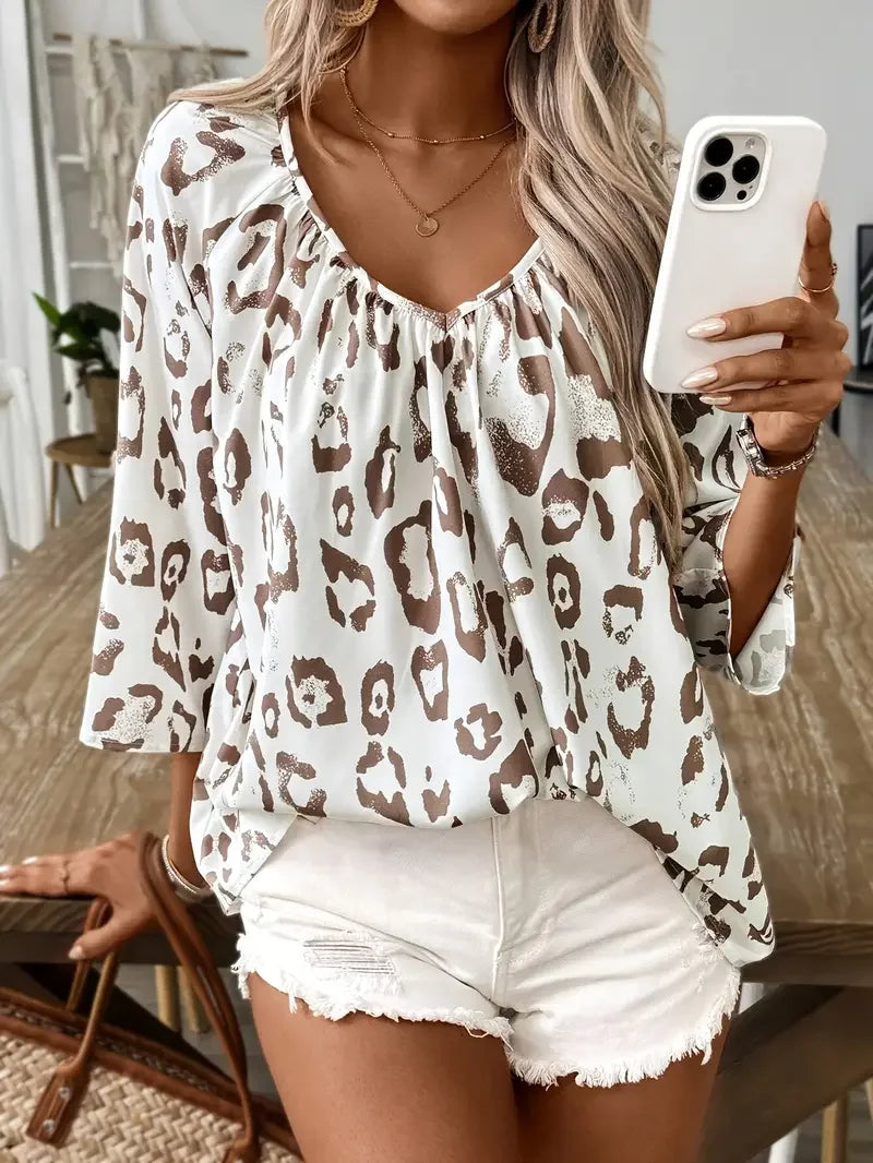 Plus Size Women Leopard Print Deep V-Neck Blouse Shirt 3/4 Sleeve Asymmetrical Shirt with Ruffled Hem & Ruched Detailing.
