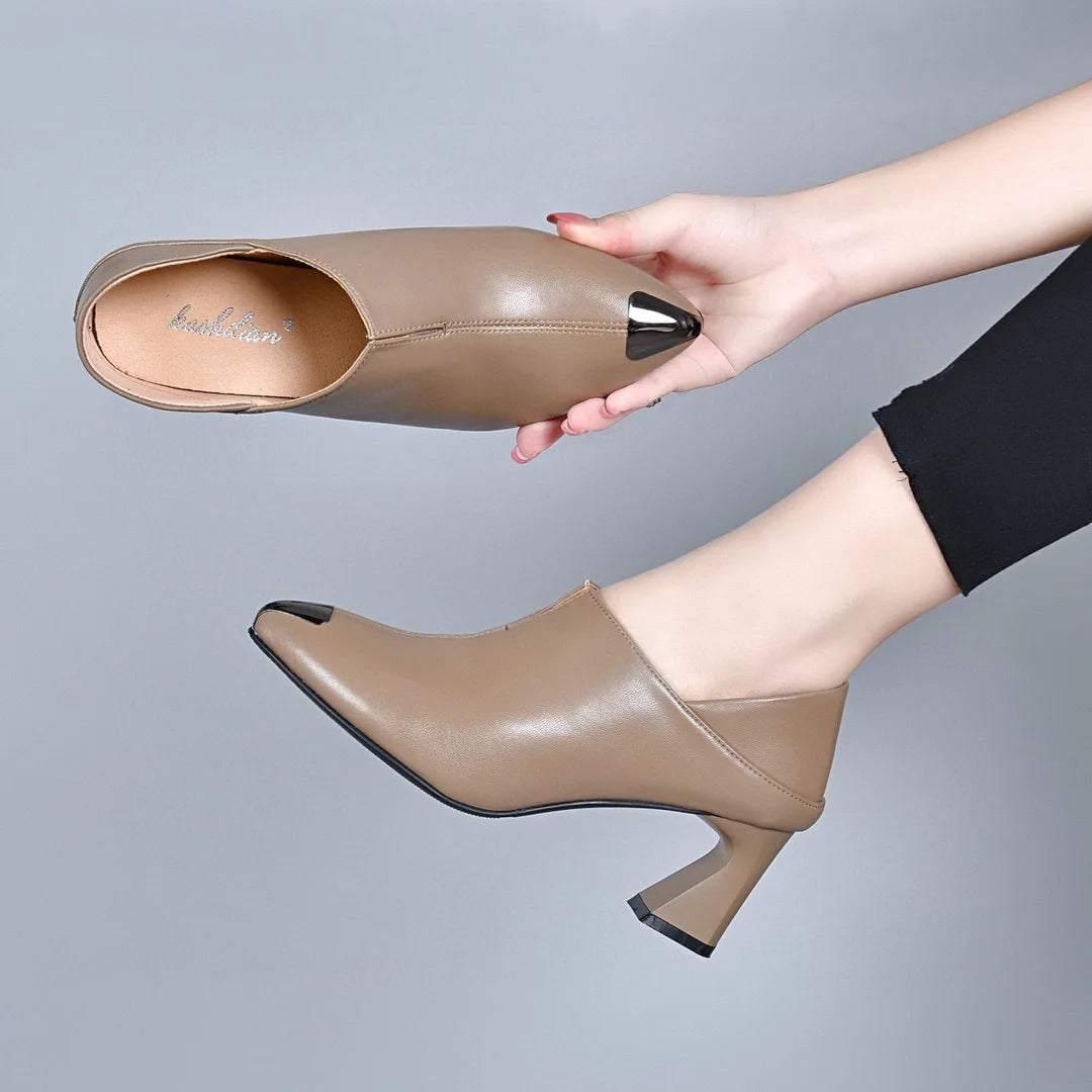 Women's pointed New European style cowhide pointed horseshoe heel .